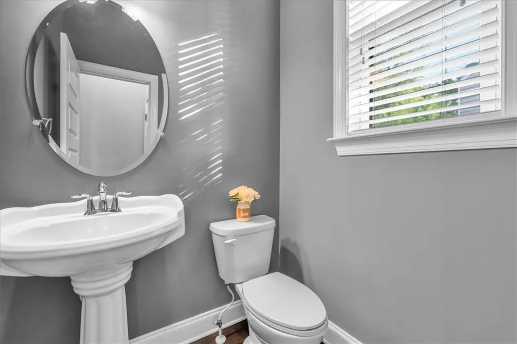 Bathroom featuring baseboards and toilet