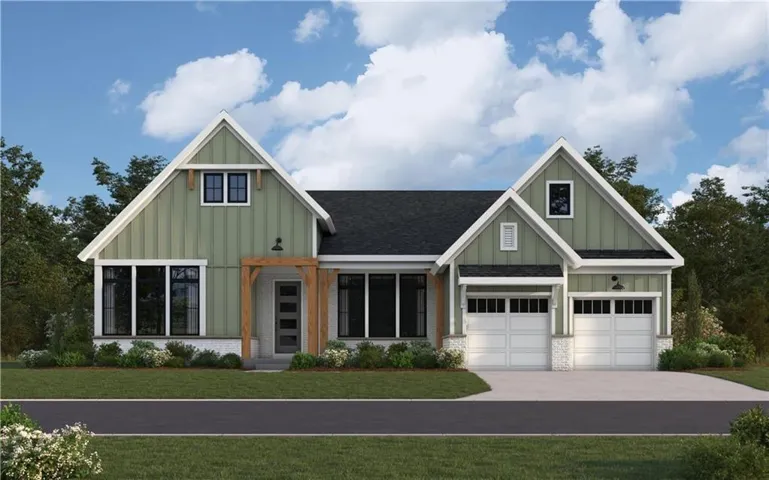 Modern farmhouse exterior with green vertical siding and white trim