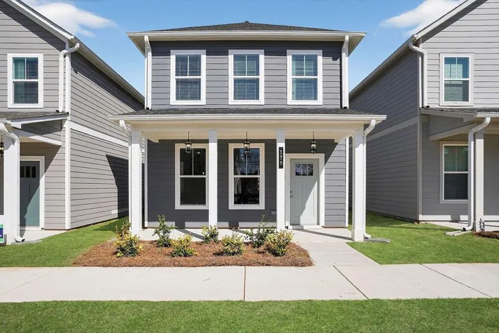 Two-story exterior with horizontal siding and white trim