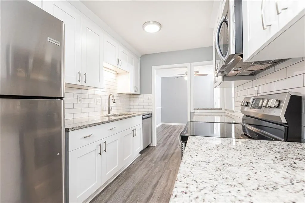Stainless steel appliances and granite counter tops.