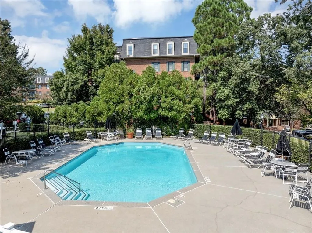 Community pool with a patio area