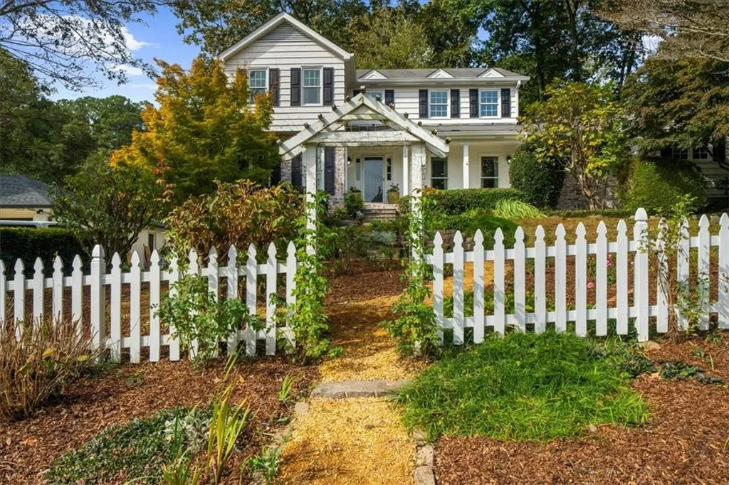 View of front facade featuring a fenced front yard and a porch