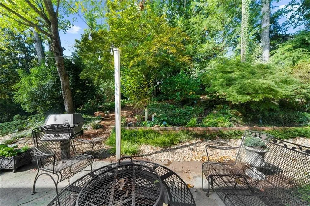View of patio featuring view of wooded area