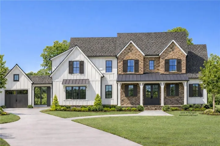 Two-story residence featuring a combination of board-and-batten siding and brick facade