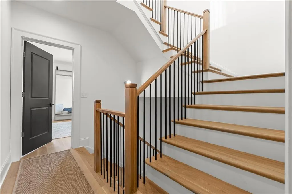 Hardwoods and wrought iron throughout.