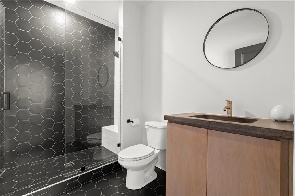 Full bath located on the terrace or basement level bedroom.