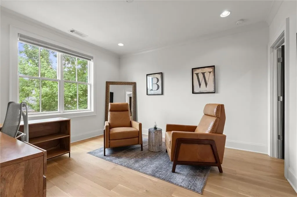 Secondary bedroom currently used as an office located on the same level as the primary suite.