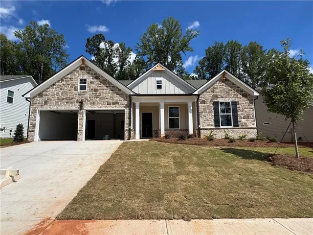 Stone and siding exterior with gabled roof lines
