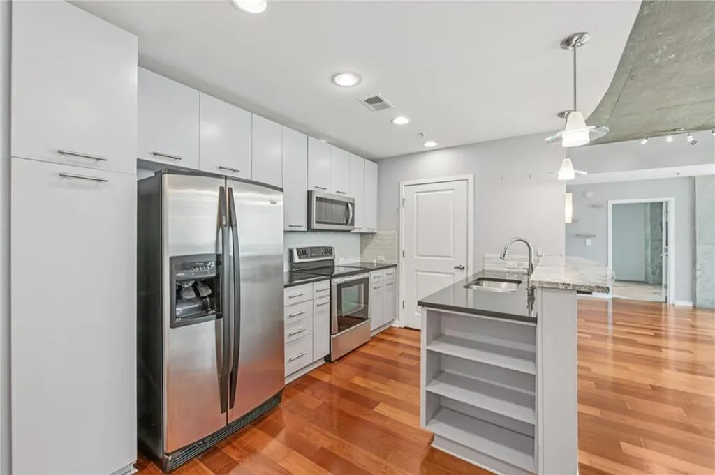 Upgraded kitchen featuring pendant lighting over breakfast bar
