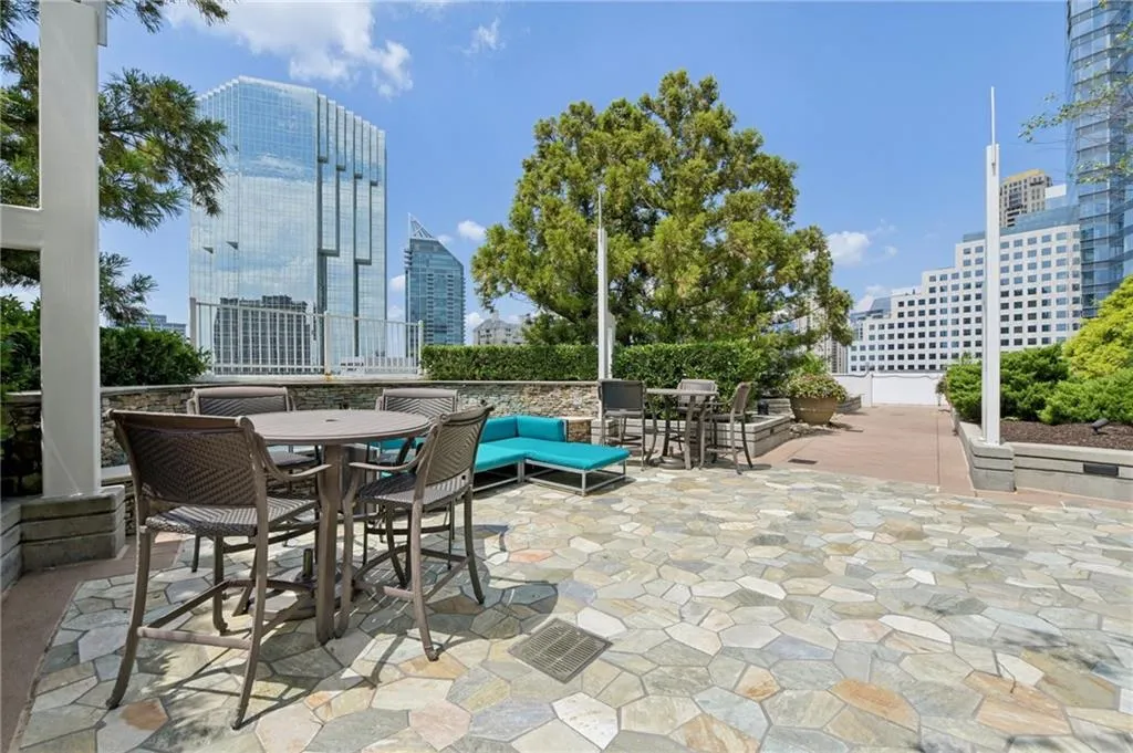 View of patio with a skyline view and outdoor dining space