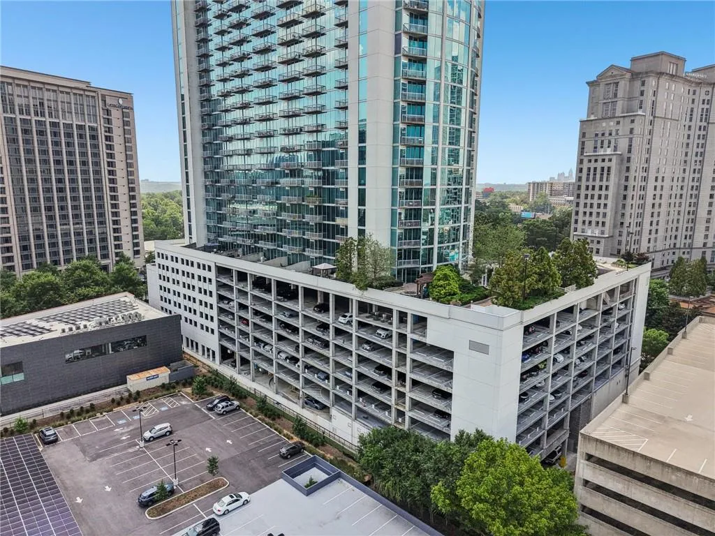 View of property featuring parking deck