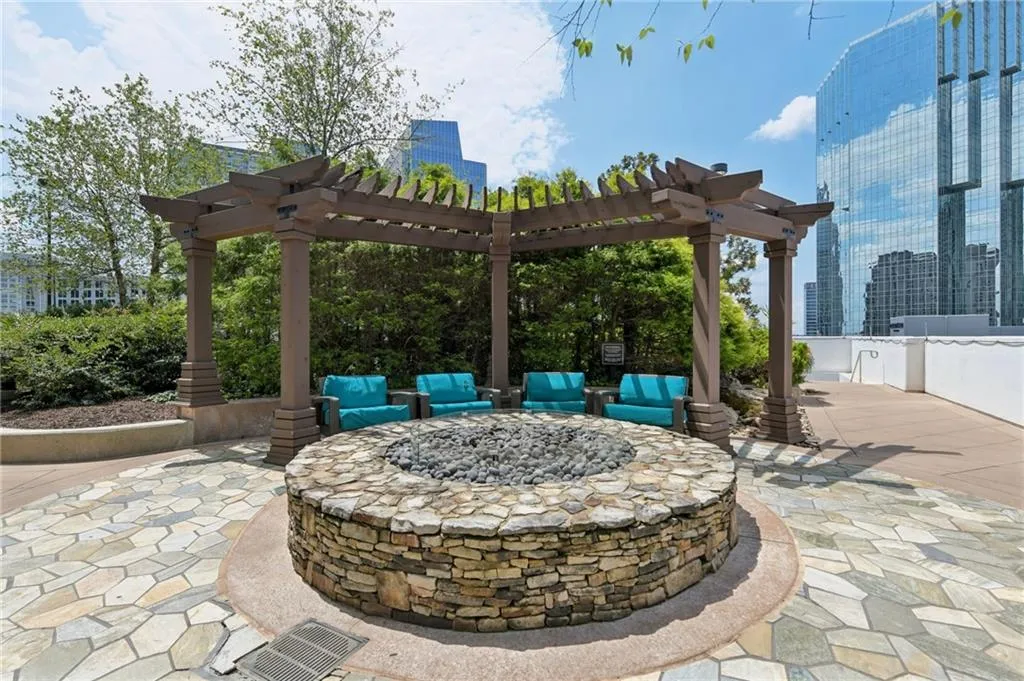 View of patio / terrace featuring a fire pit and a pergola