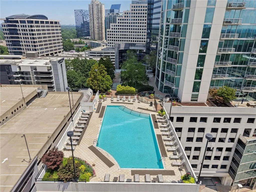 Community pool featuring a view of city