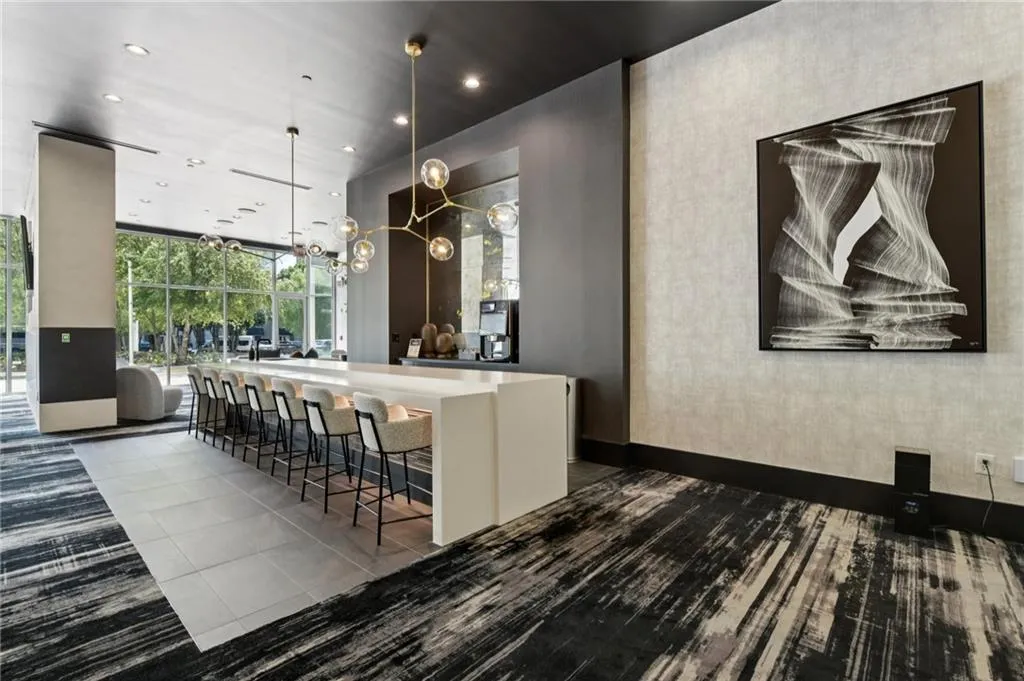 Recently renovated 24 hour coffee bar area with recessed lighting, hanging light fixtures, and floor to ceiling windows