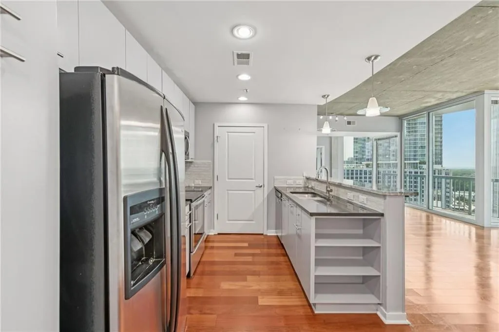 Kitchen featuring open shelves for extra storage