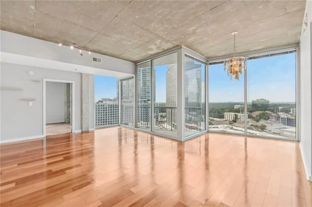 Open concept living/dining areas with panoramic city views