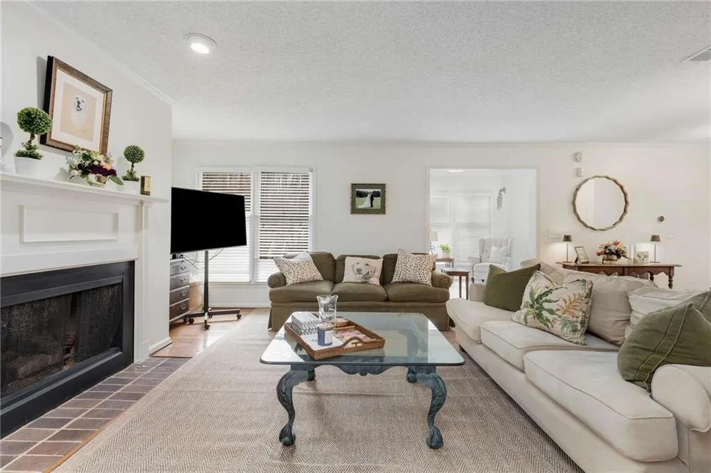 The cozy gas fireplace in the living room adds an element of warmth & charm to this space, a luxury rarely  found in a condominium home.