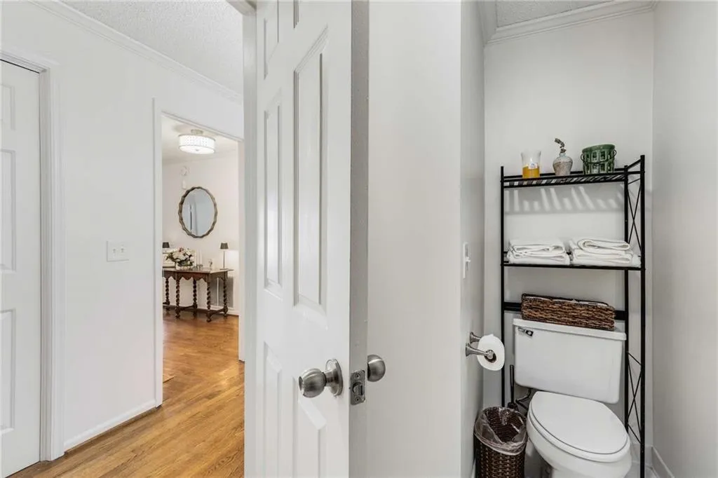 The updated guest bath looking into the hall.  Notice the flawless hardwood floors!