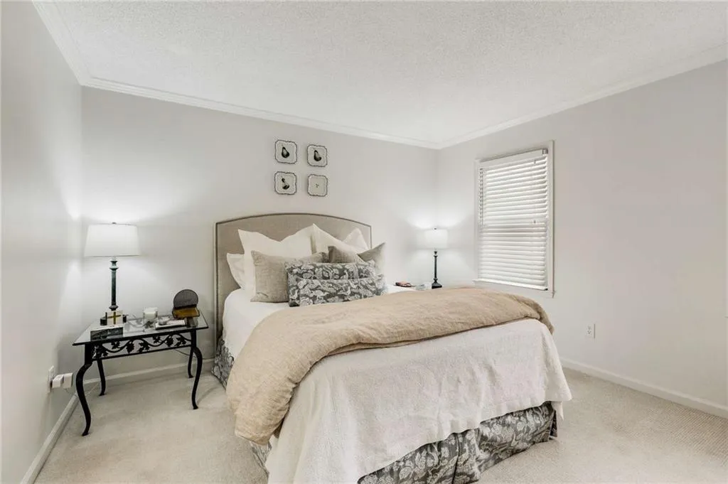 The generous primary en suite is enhanced by plush new carpeting & also features an oversized walk-in closet & full bath.