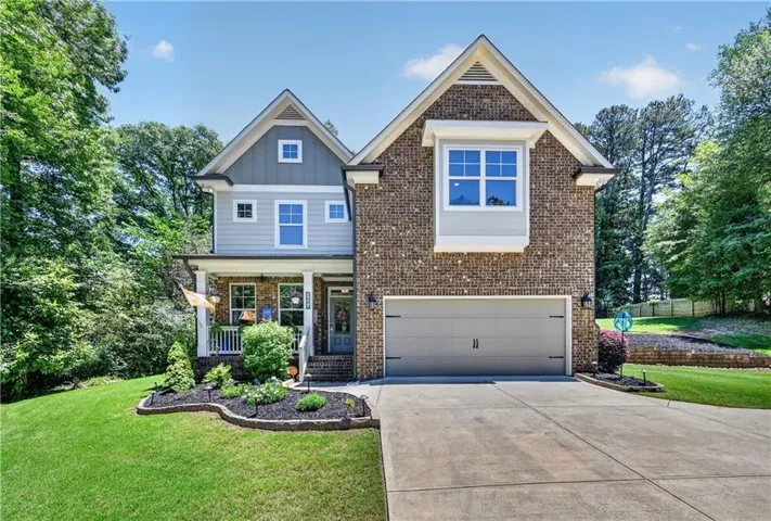 view of home entering the driveway
