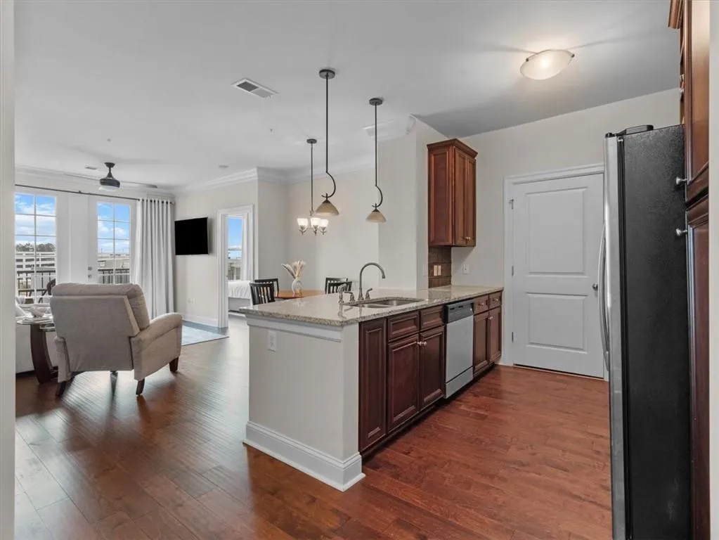 dark cabinets with light stone counters