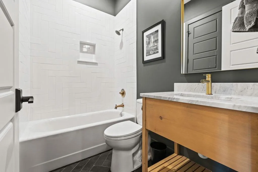 Slate herringbone flooring main level bath & custom vanity