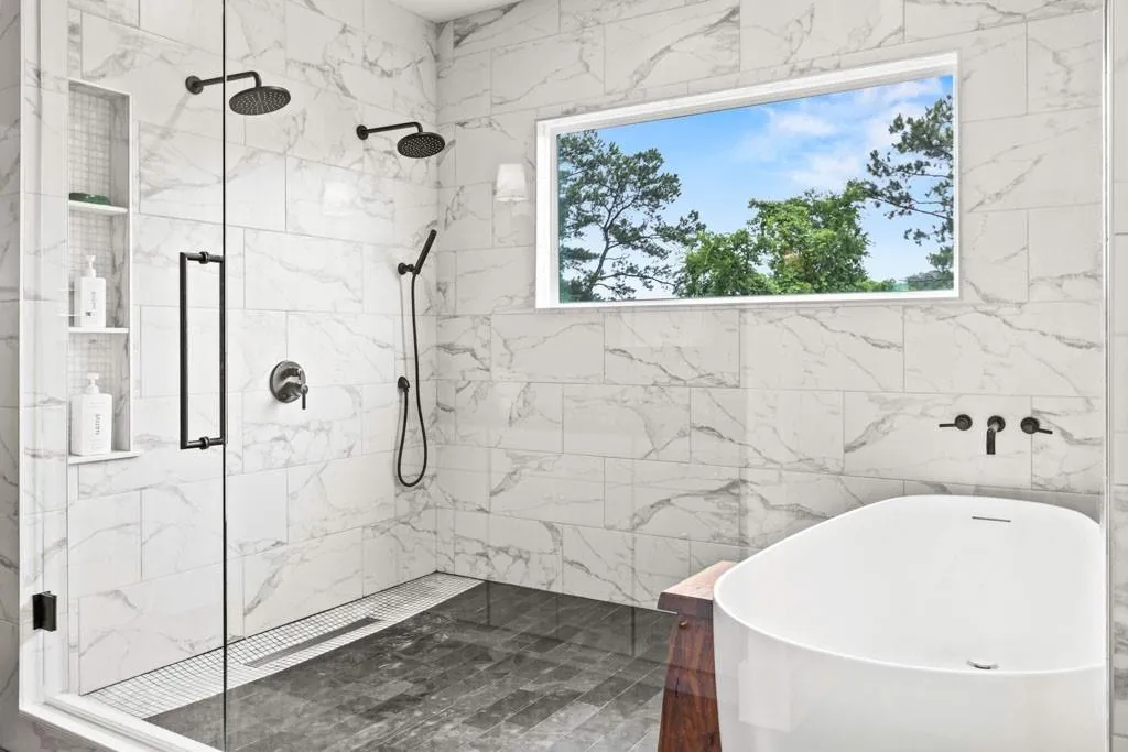 Wet room with twin shower heads & marble niche