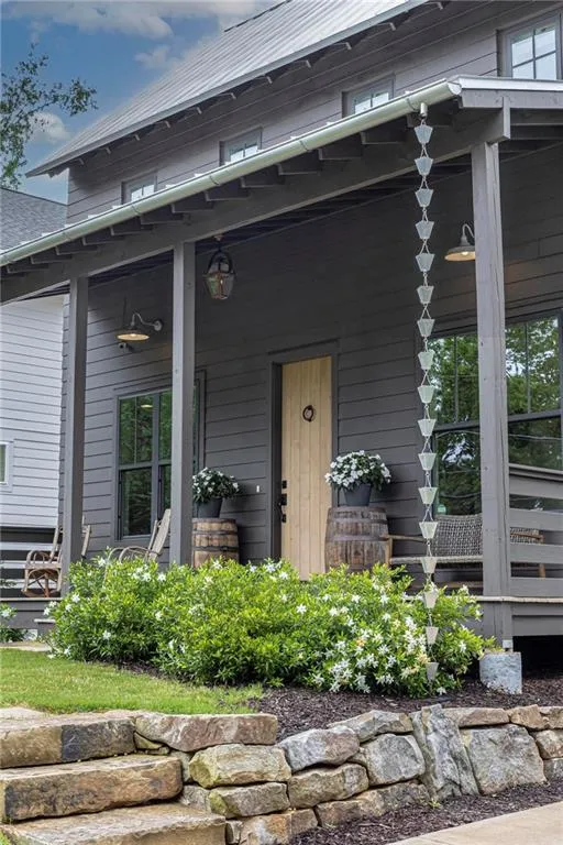 Property entrance featuring covered porch