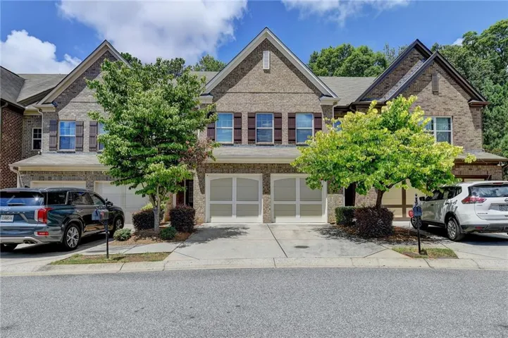 View of property featuring a garage