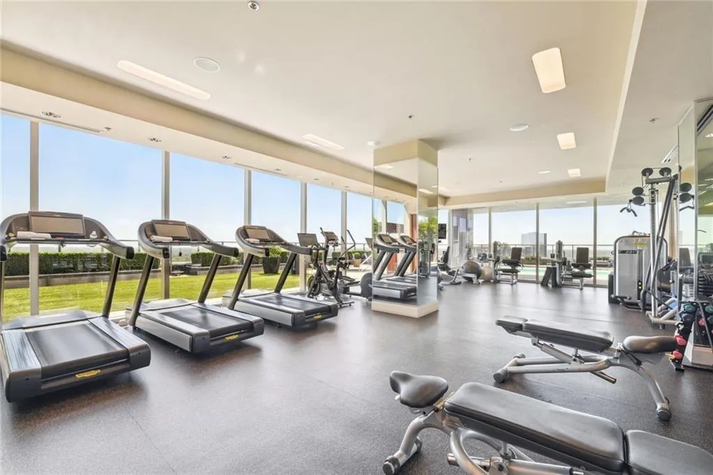 Gym with floor to ceiling windows