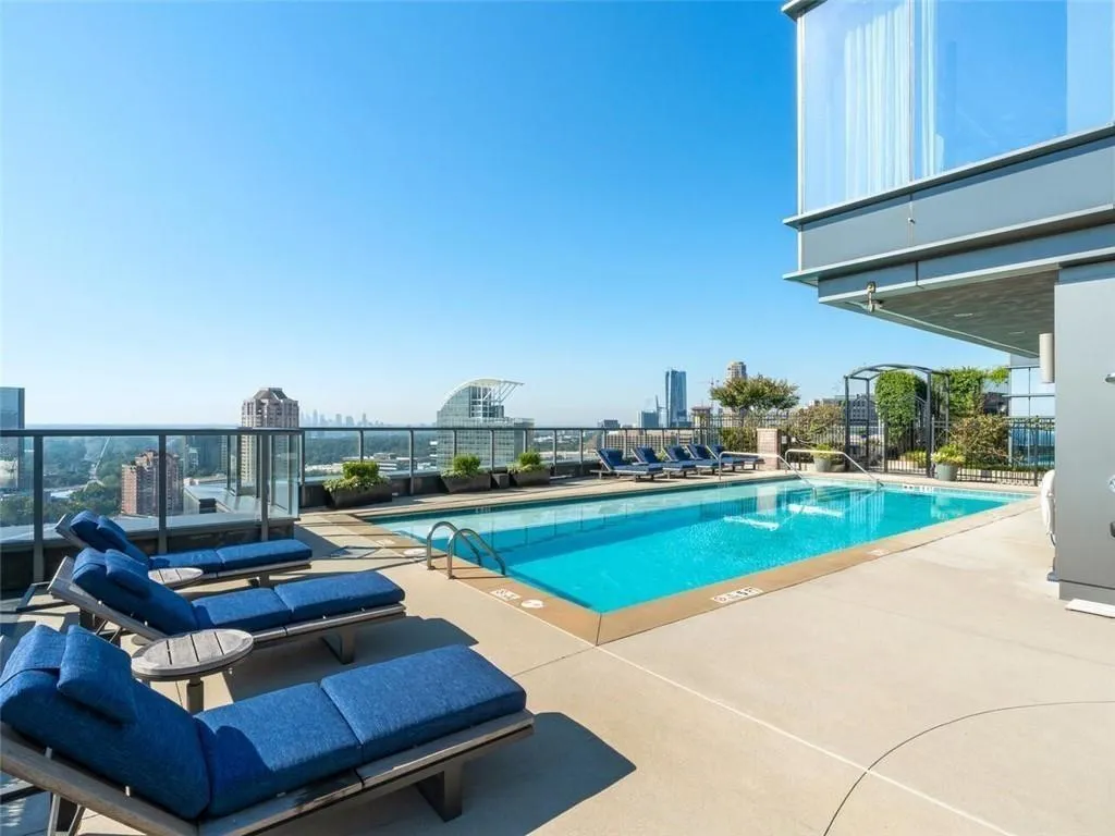 Community pool with a city view