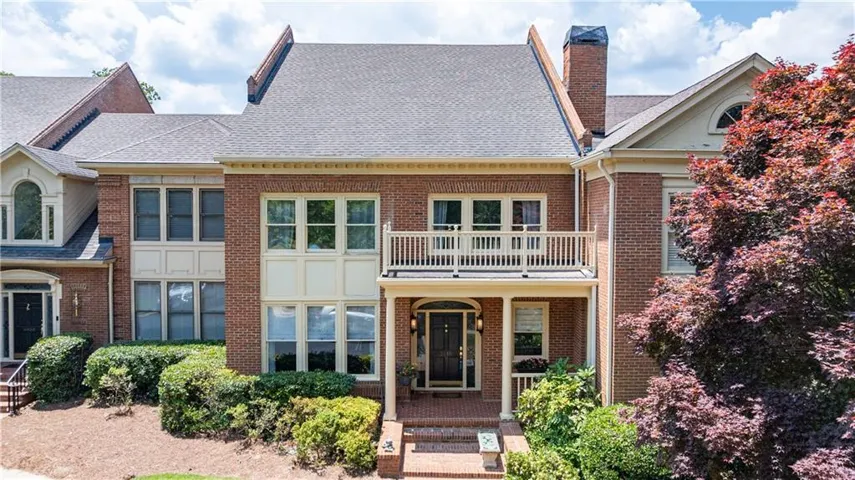 Set along the banks of the Chattahoochee River, this elegantly renovated townhome showcases sweeping water views and a remarkable blend of privacy and convenience within the gated community of Wynfield Gables