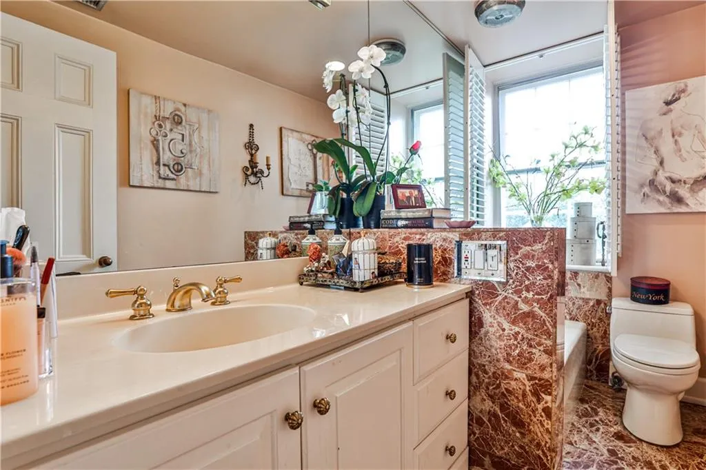 Bathroom featuring vanity and toilet