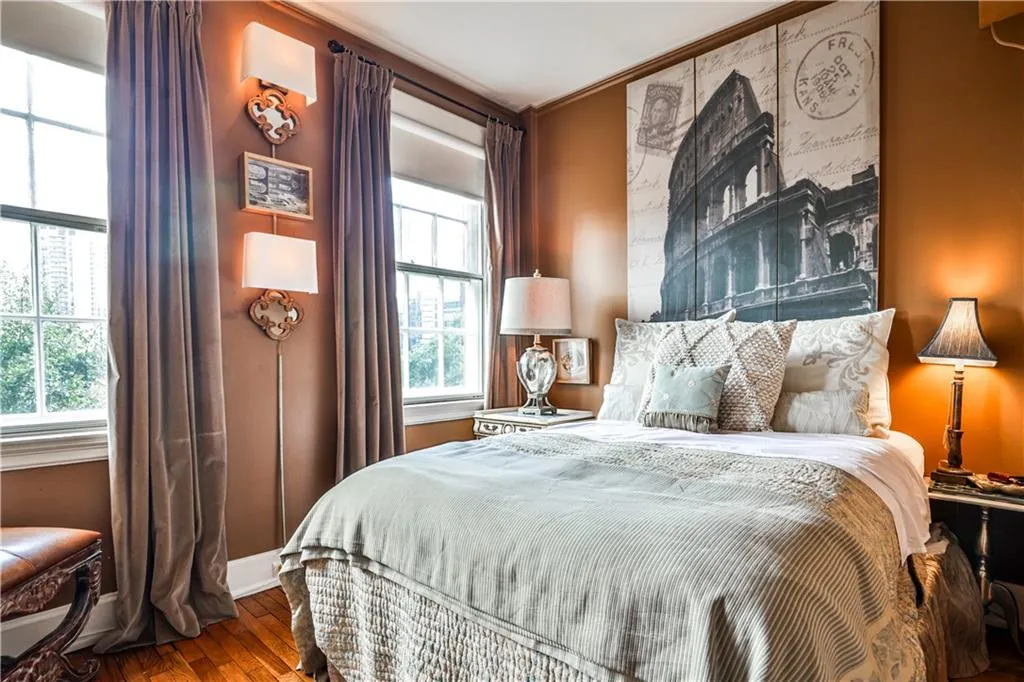Bedroom featuring wood finished floors and baseboards