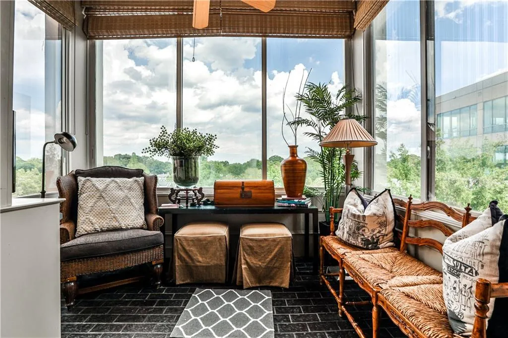 Sunroom with healthy amount of natural light and brick patterned floors