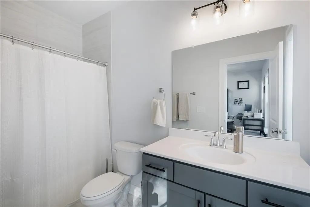 Bathroom featuring vanity and a shower with curtain
