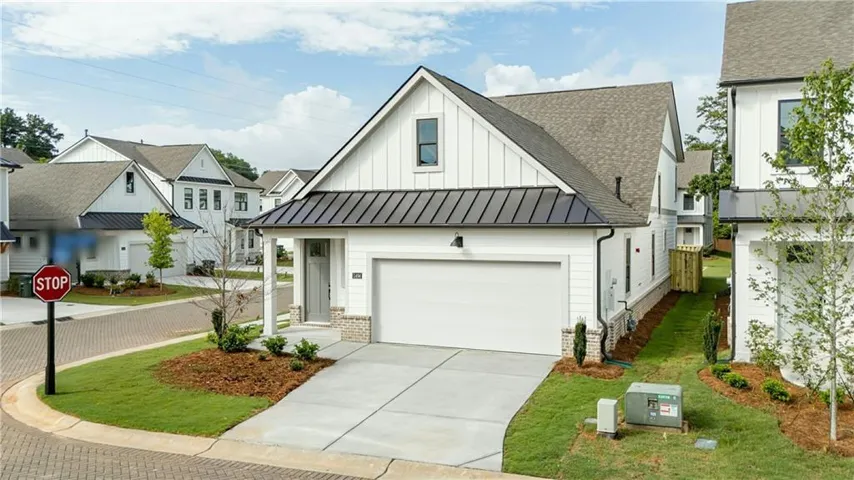 White board-and-batten exterior with contrasting dark trim