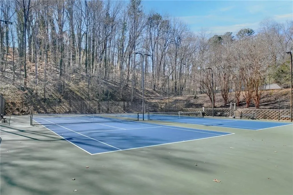 View of tennis court with fence