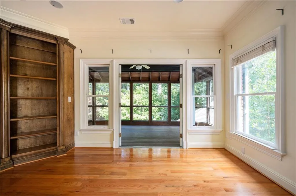 Second floor living room with access to screened porch
