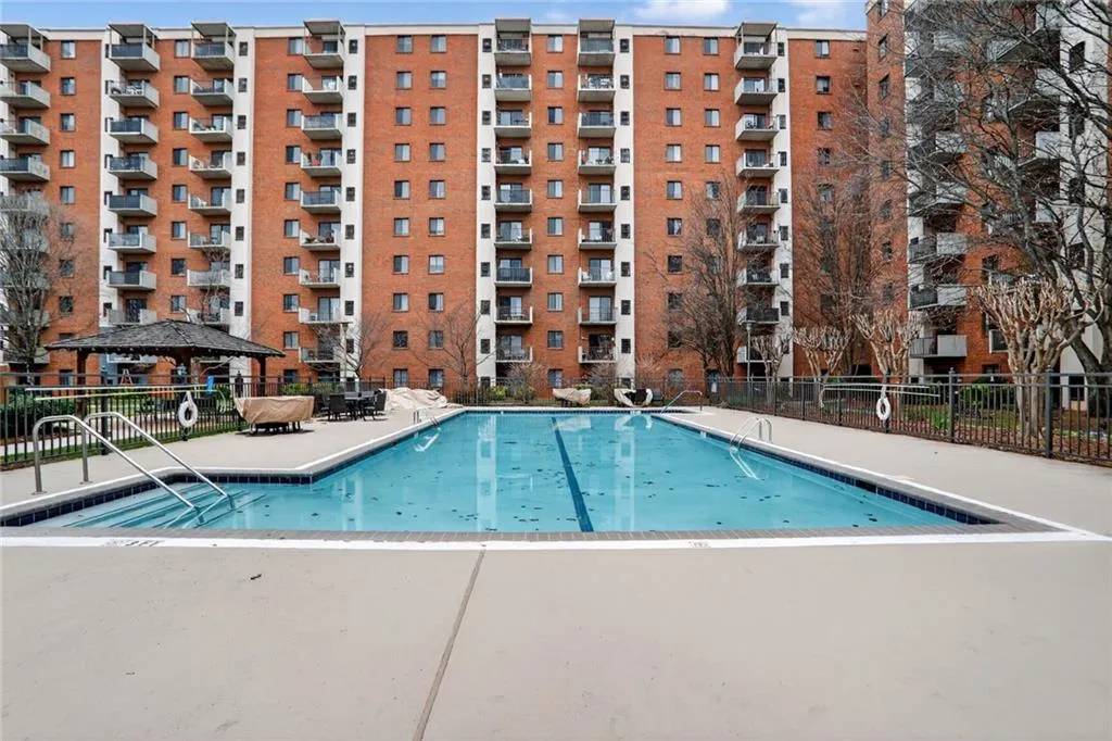 Community pool featuring a patio and a gazebo
