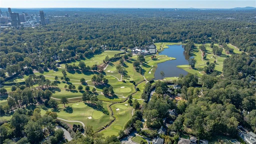 View of property location with a nearby body of water and a golf club View of property location with a nearby body of water and a golf club