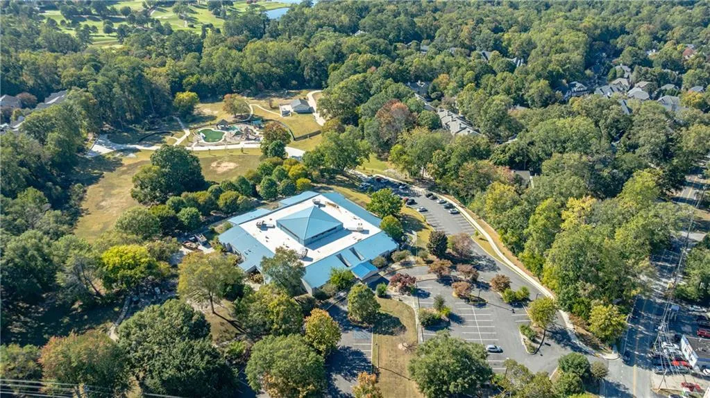 Aerial overview of property's location featuring a heavily wooded area Aerial overview of property's location featuring a heavily wooded area