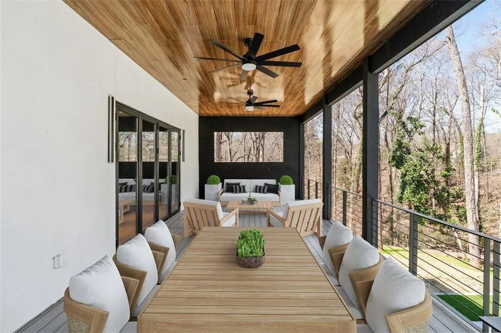 Sunroom / solarium with wood ceiling, french doors, and floor to ceiling windows