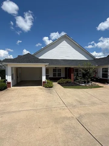 White siding exterior with a dark shingled roof