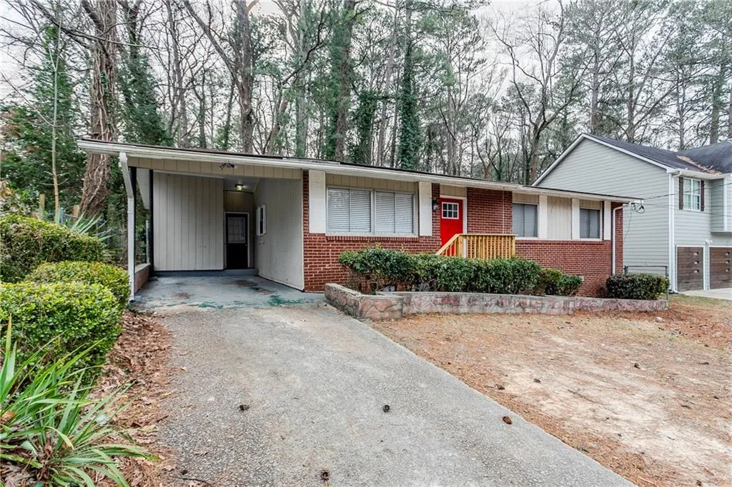 View of front of property with a carport