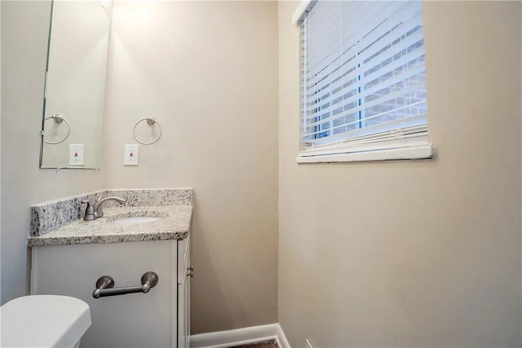 Bathroom featuring vanity and toilet