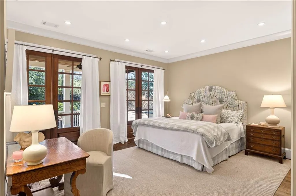 Bedroom featuring french doors, recessed lighting, ornamental molding, wood finished floors, and access to outside