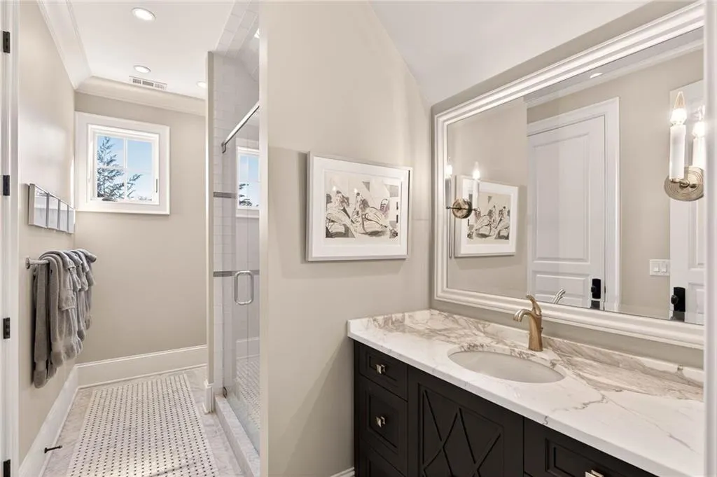 Full bath featuring a shower stall, vanity, recessed lighting, ornamental molding, and light tile patterned floors