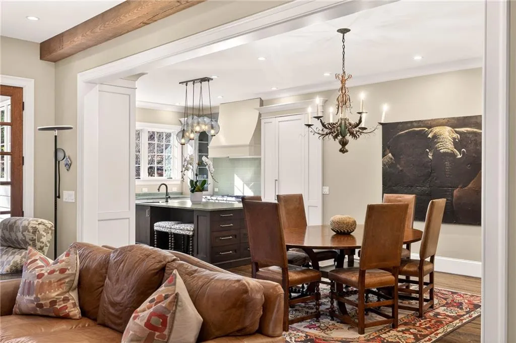 Dining room featuring a chandelier, dark wood-type flooring, recessed lighting, and ornamental molding