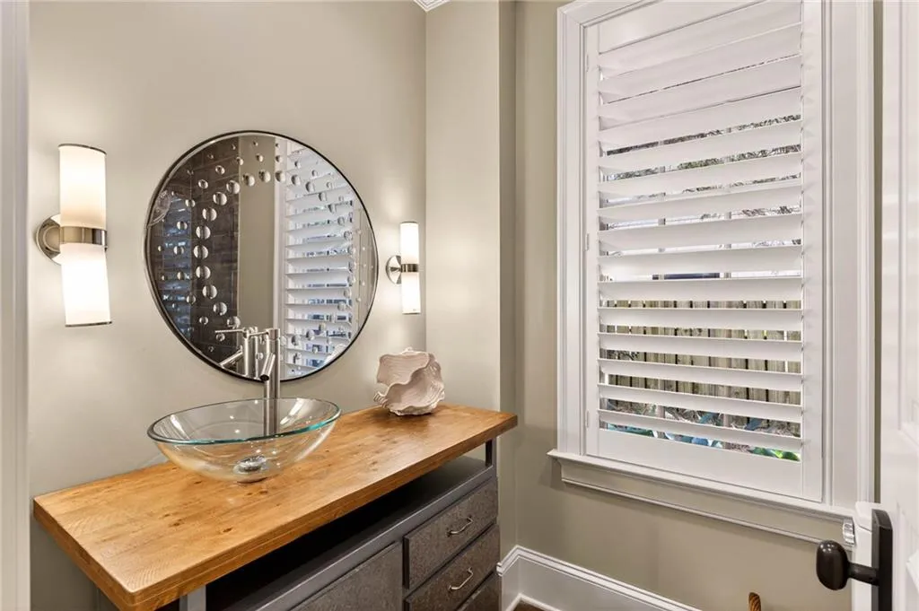 Bathroom view of vanity and baseboards
